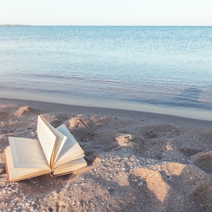 Story book on the sand by the ocean